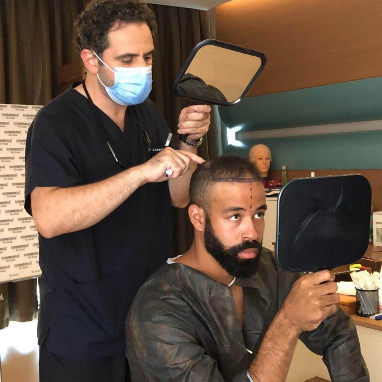 Dr. Acar examines Dalton Pompey's hair